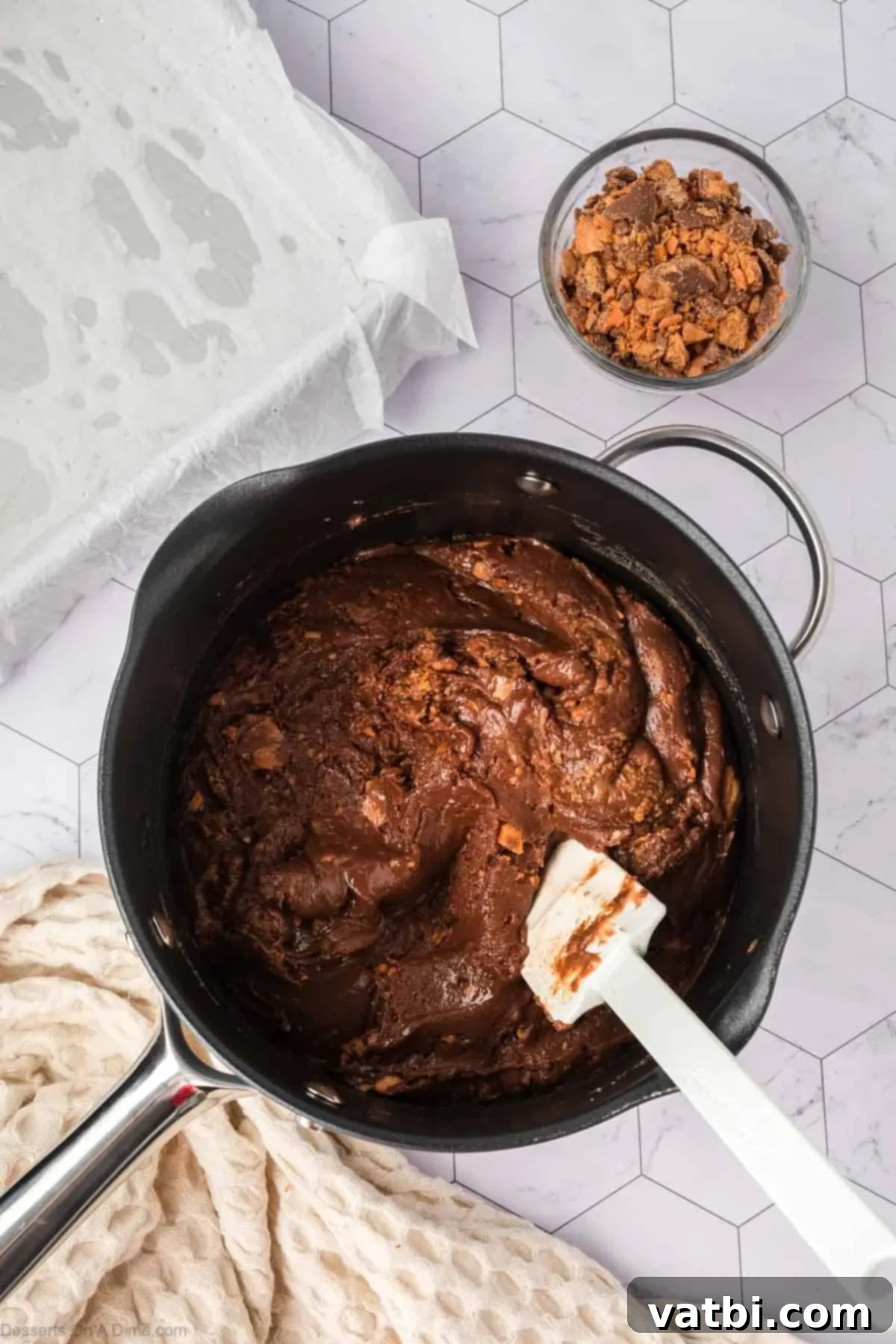 Butterfingers folded into mixture. 