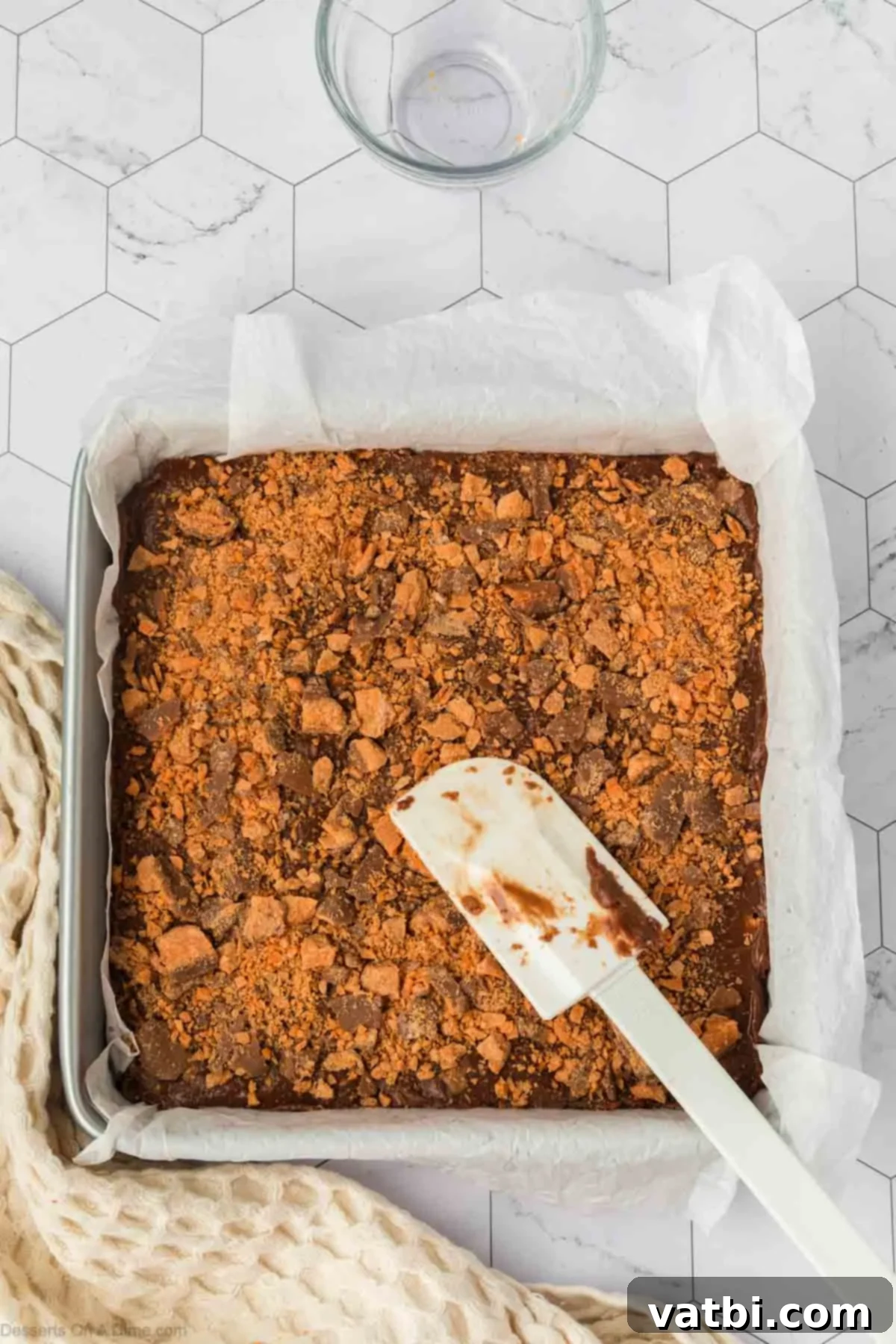 Butterfinger pieces sprinkled on top. 