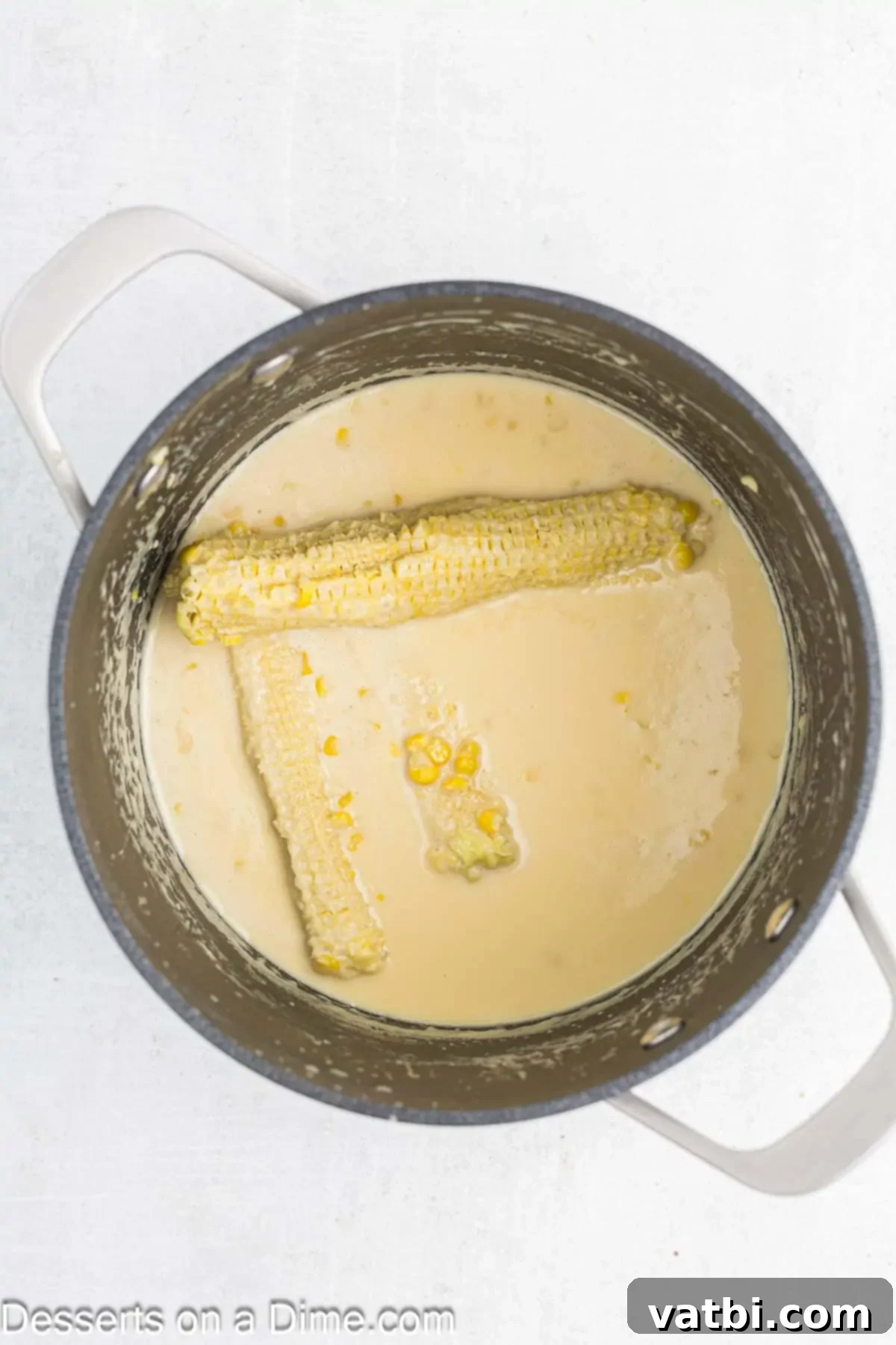 Corn on the cob in milk mixture.