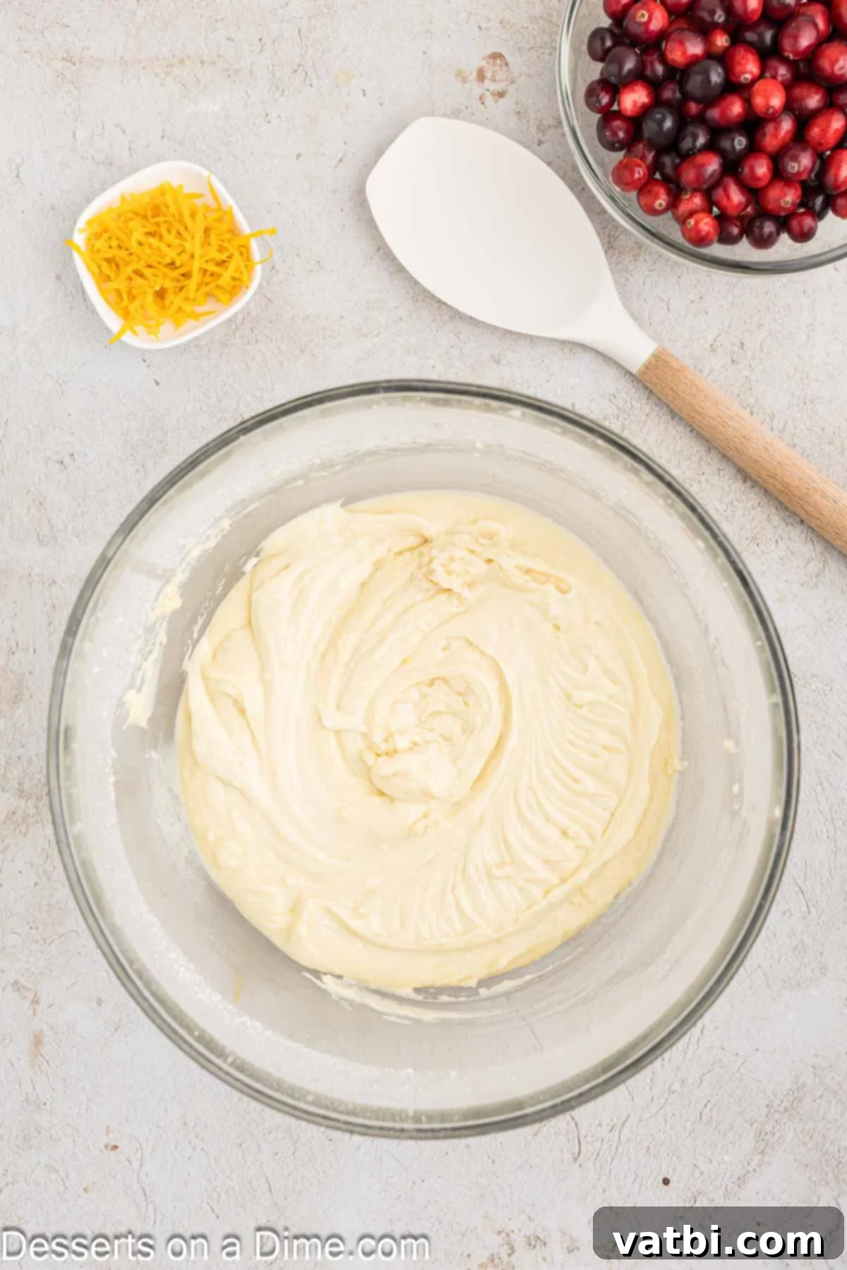 Zesty Orange Cranberry Loaf 6 Orange cranberry bread batter fully combined in a mixing bowl, prior to adding cranberries and zest.