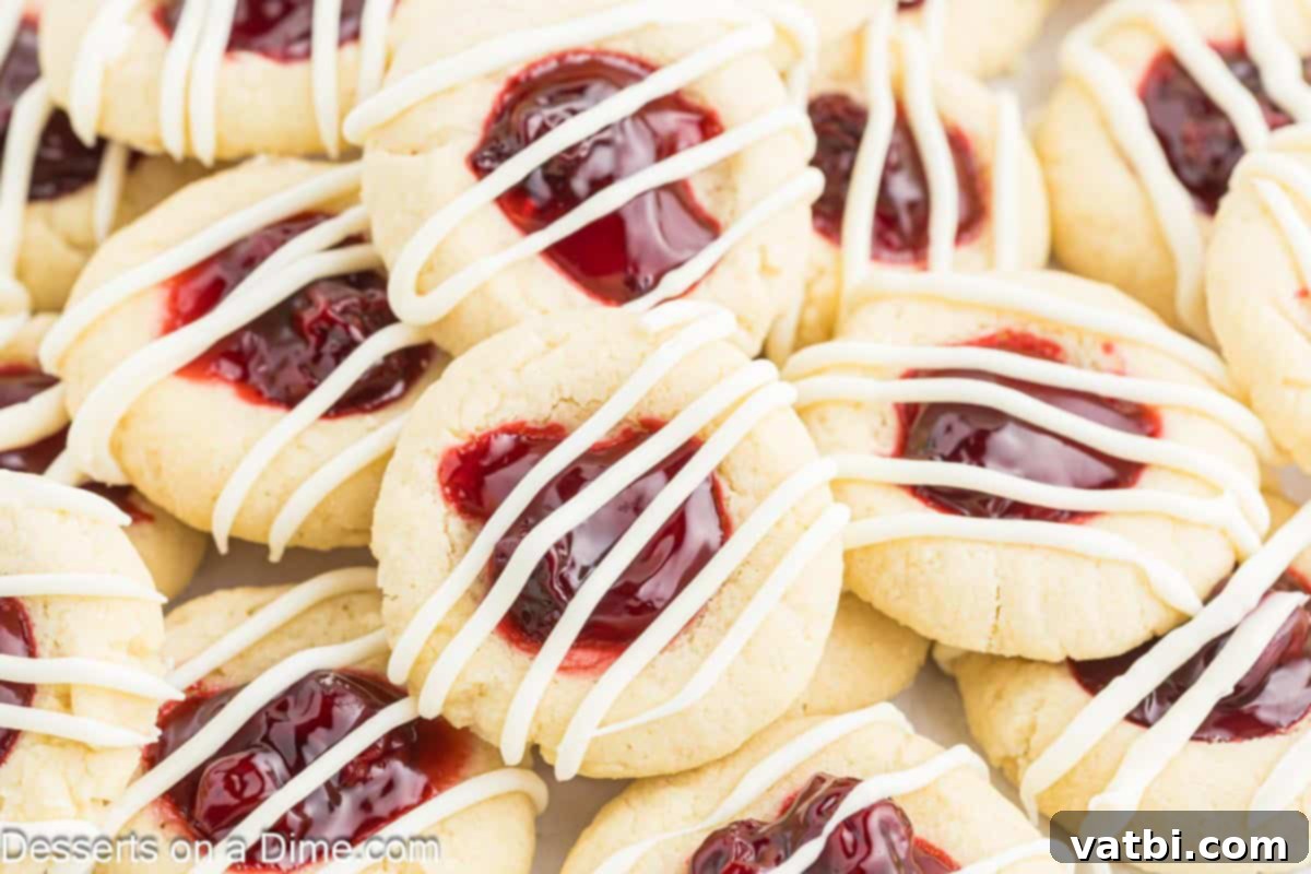 Cherry Thumbprint cookies stacked together.