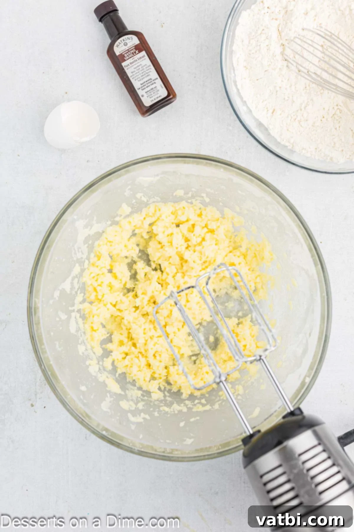 Butter and sugar mixed together in a bowl.