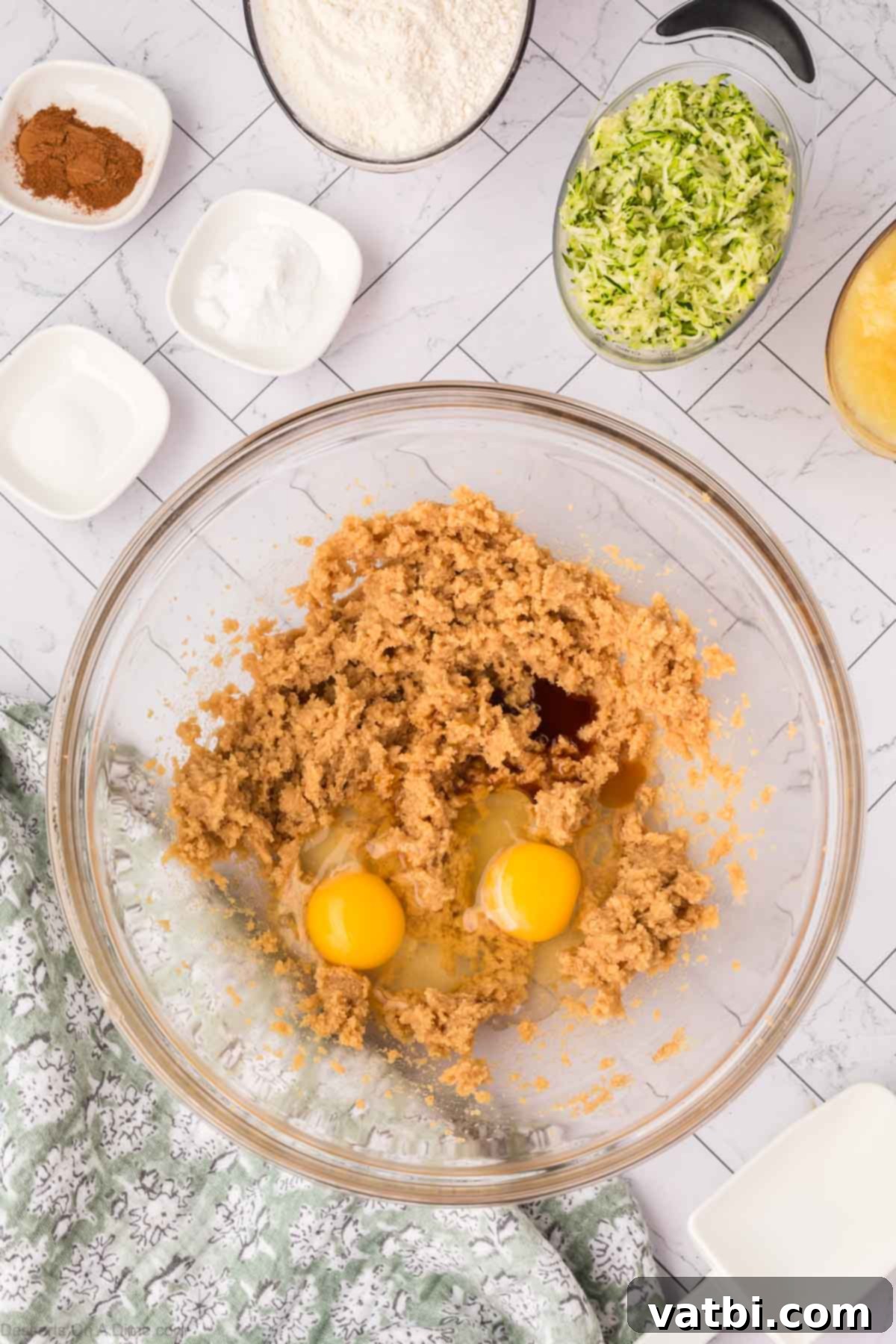 Eggs and vanilla extract mixed into the creamed butter and sugar.