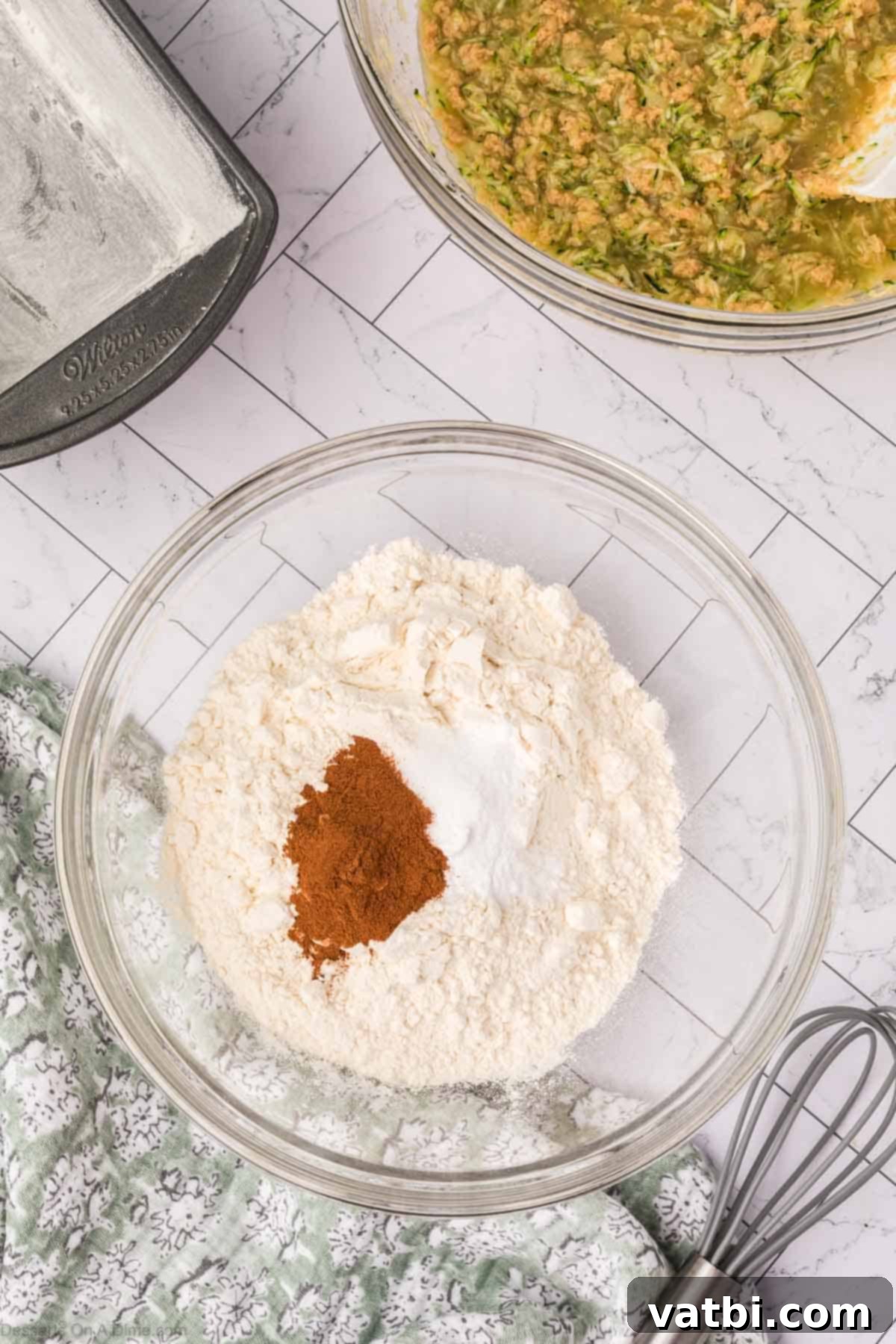 A separate mixing bowl containing all the dry ingredients.