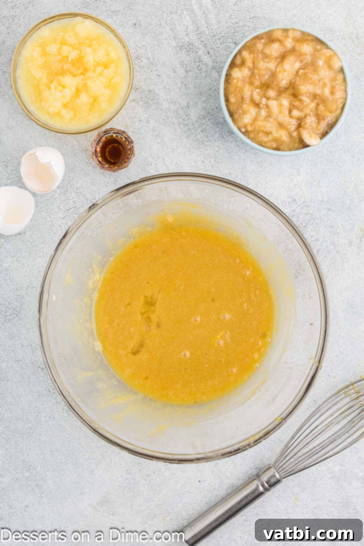 Tropical Sunshine Loaf 5 Eggs whisked together with the butter and sugar mixture, creating a smooth and emulsified base.