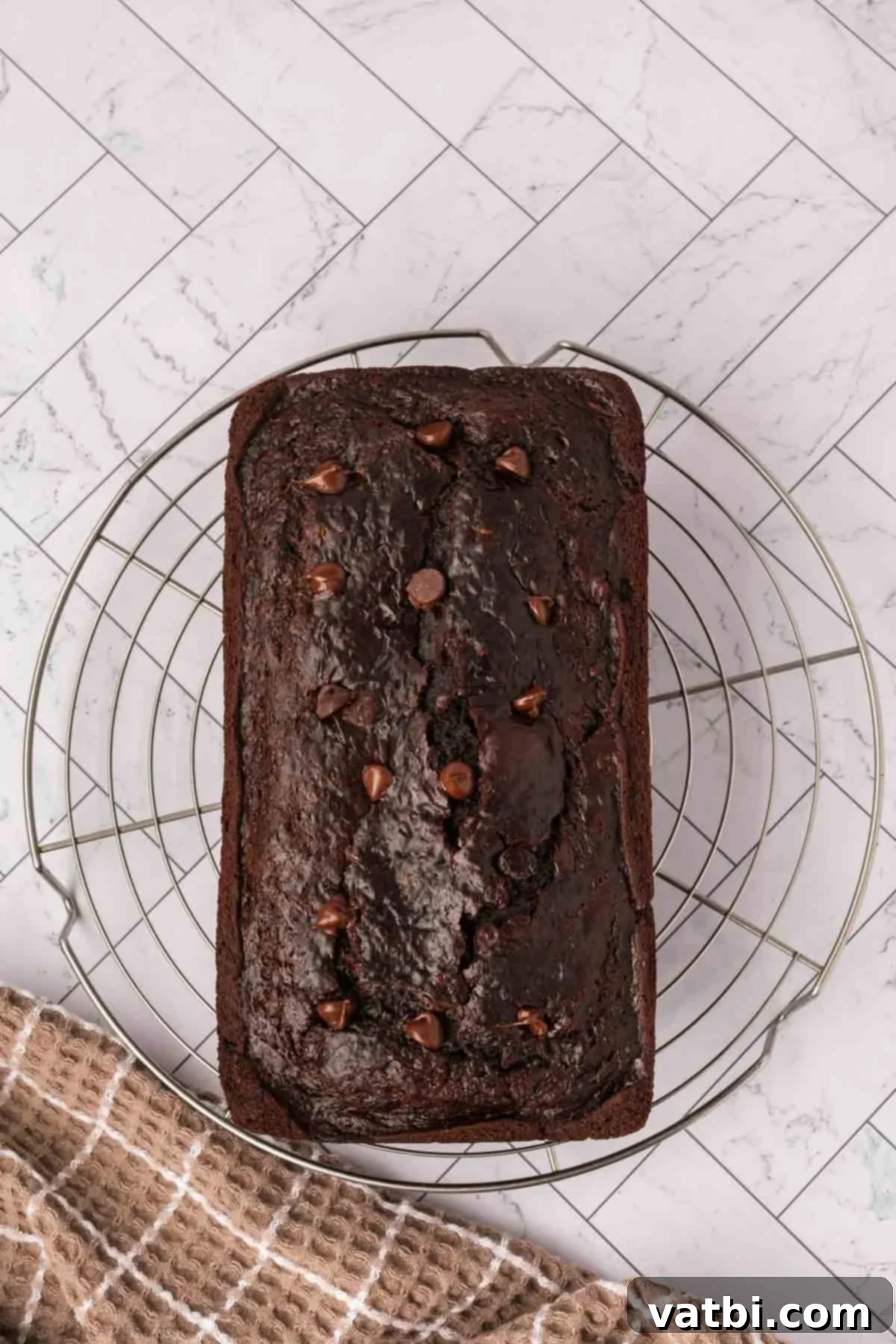 Chocolate Zucchini Bliss 11 Baked chocolate zucchini bread cooling on a wire rack.