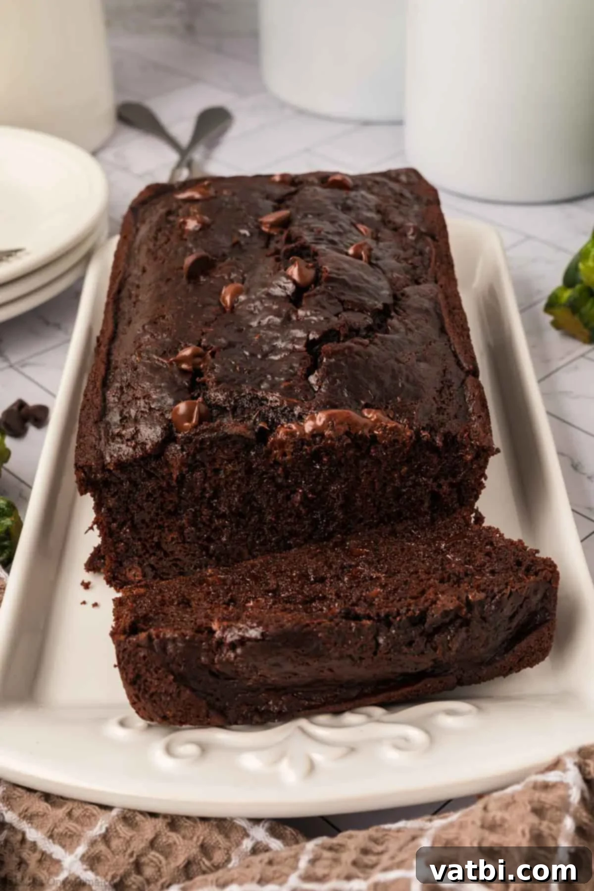 Chocolate Zucchini Bliss 12 Delicious chocolate zucchini bread being sliced and ready to serve.