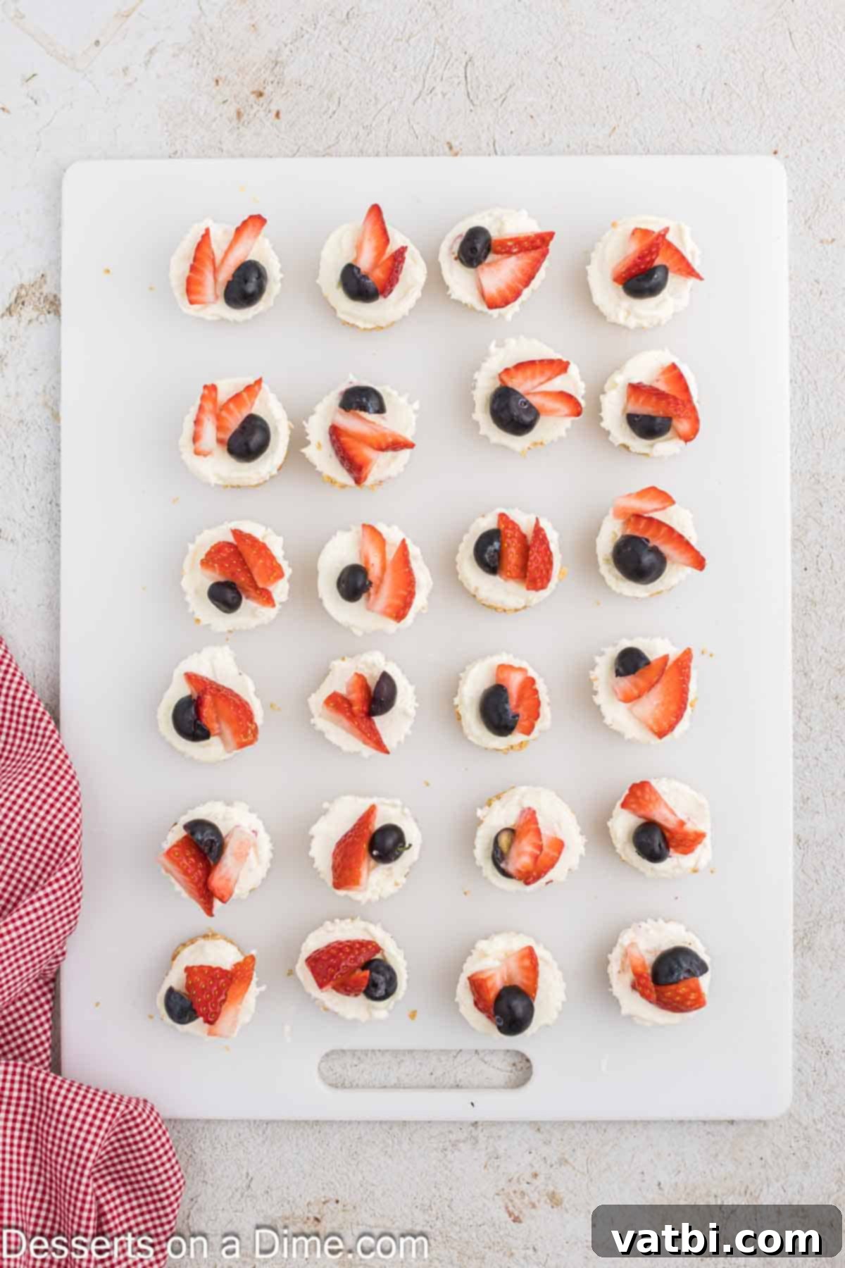 Fresh berries artfully arranged on top of each mini cheesecake, adding a burst of color and flavor.