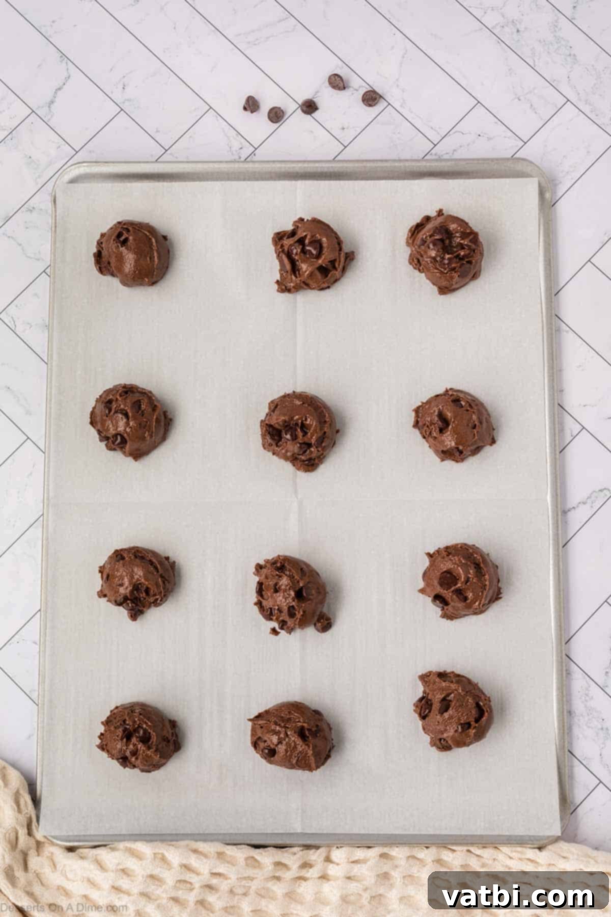 Devilishly Delicious: Sinfully Simple Chocolate Cookies 6 Cookie dough balls on baking sheet.