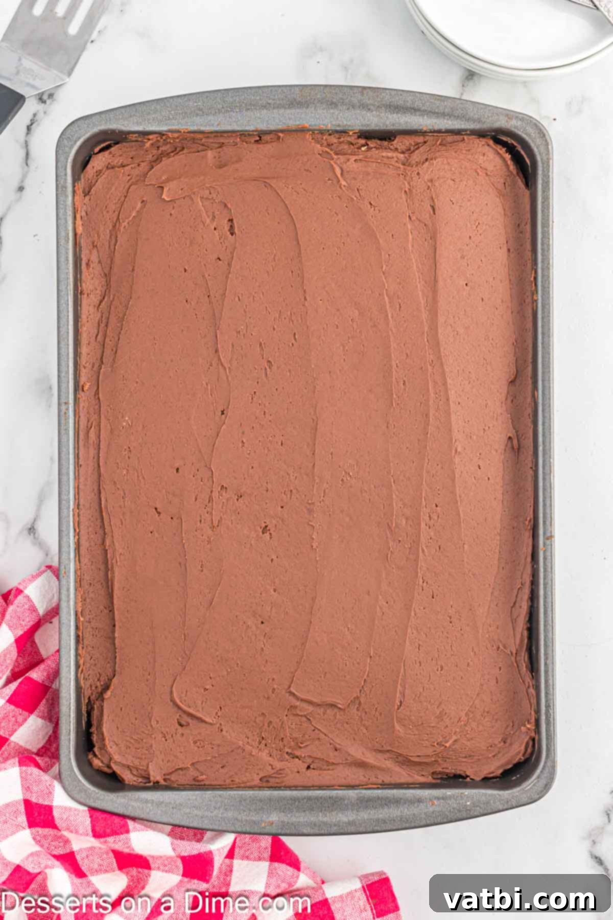 Frosting spread on cake.